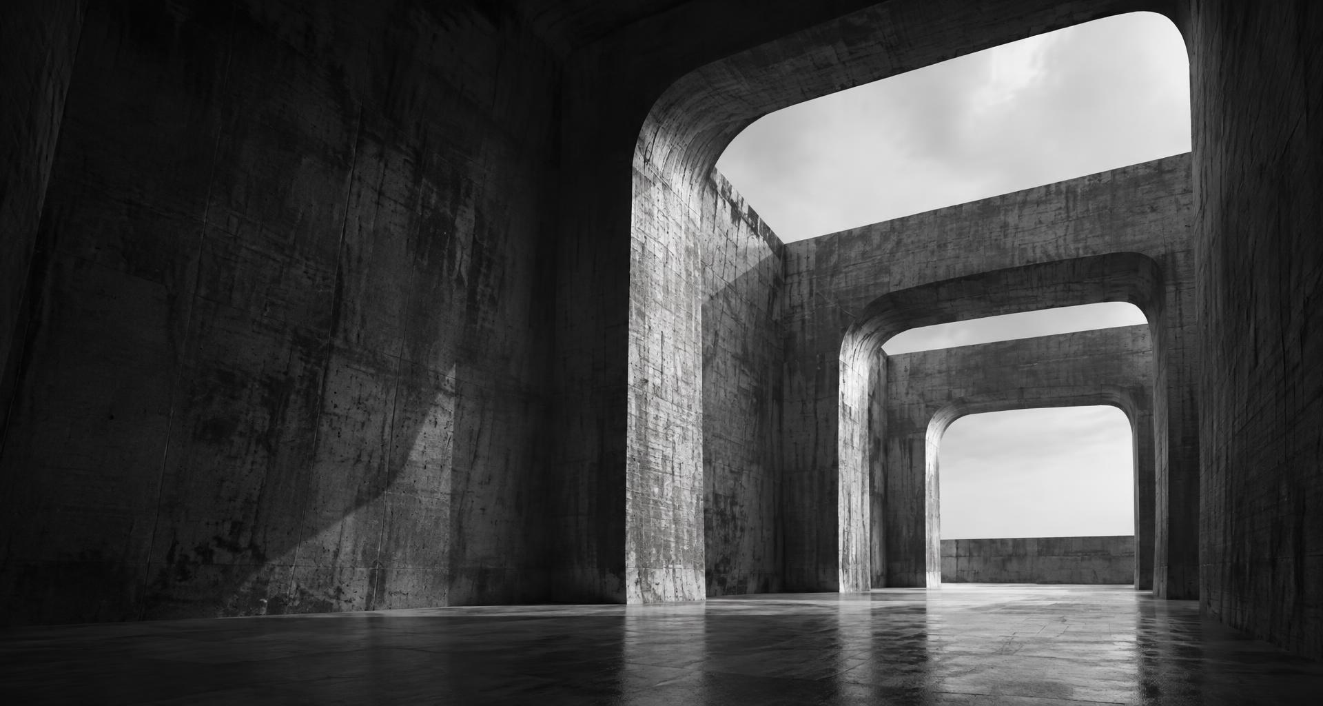 Monumental concrete portals lit by natural daylight